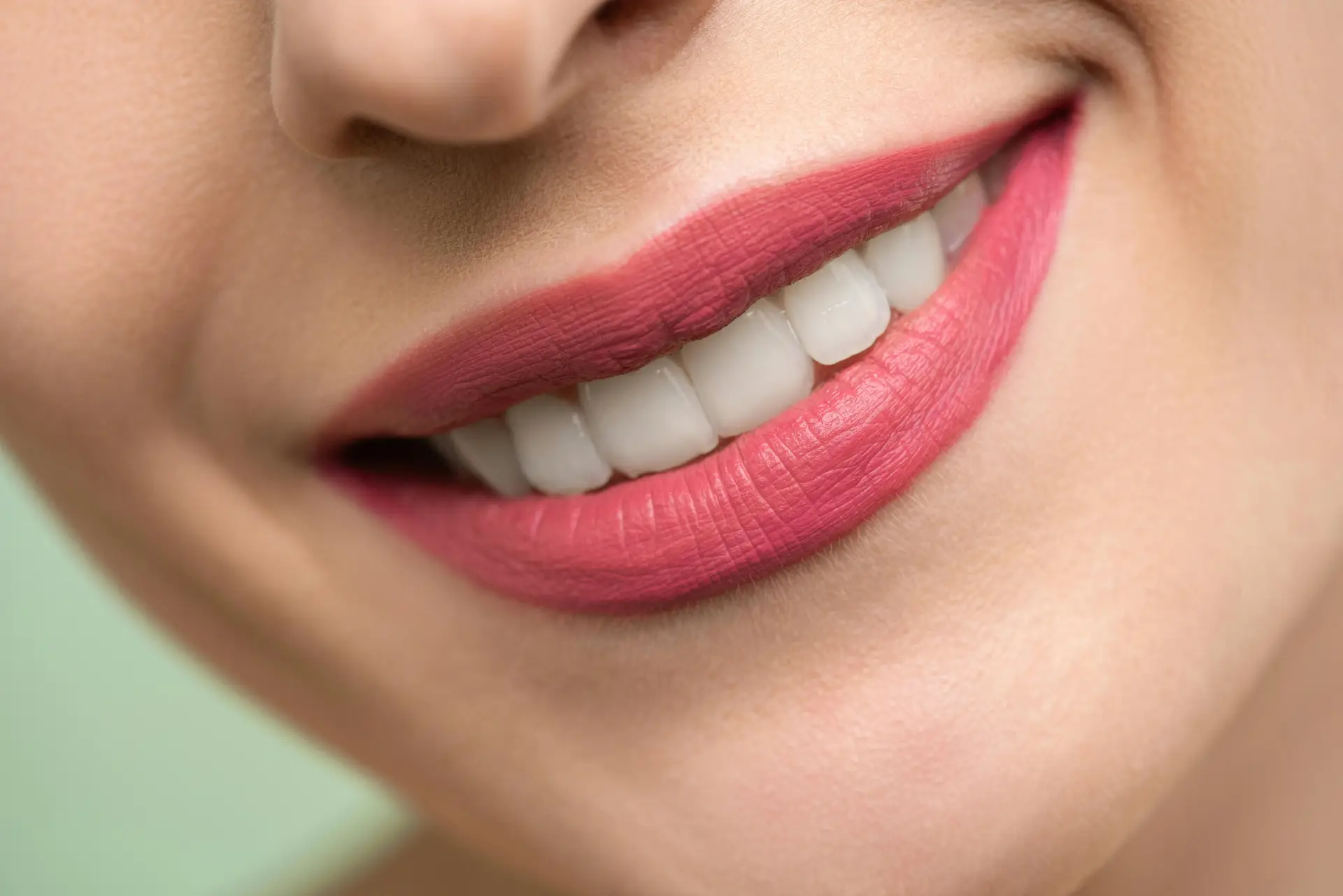 pexelsphoto37624533762453 TRIPLA travel as it should be Vivid close up image of a womans smile showcasing red lipstick and white teeth on a light background